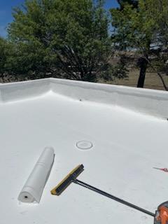 Freshly applied white elastomeric coating on Tucson flat roof